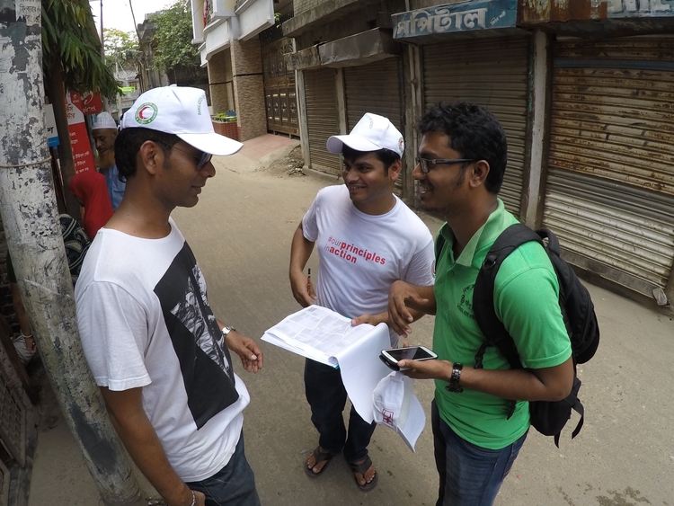three men planning a field survey to collect OpenStreetMap data